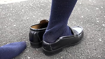 Walking With Her Heel On Her Shoe