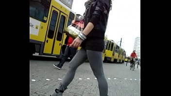 ⁣Candid Girl In Short Skirt Grey Leggings And High Heel Ankle Boots