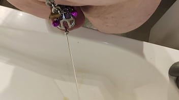 Submissive Pissing Thru Catheter Being Locked In Small Chastity Cage