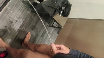 Pissing In A Fitting Room, Using A Pair Of Pants
