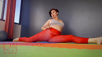Regina Noir. A Woman In Yoga Leotards Practices Yoga In The Gym. Transparent Red Leotard Yoga. Pantyhose C1